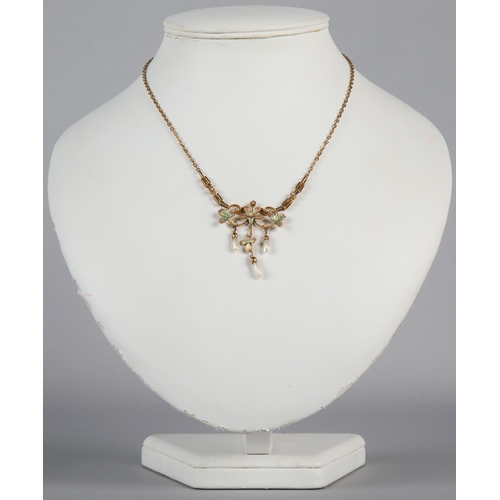 153 - 9ct gold necklace with floral and seed pearl pendant, gross weight, 7.6g.