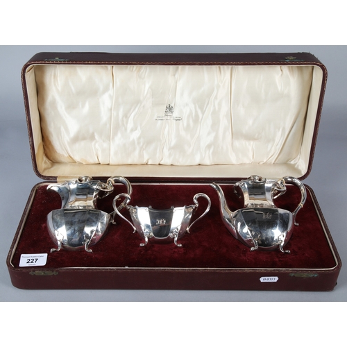 227 - Silver three piece tea service, Edward & Sons, comprising of two tea pots and a sugar bowl, Glas... 