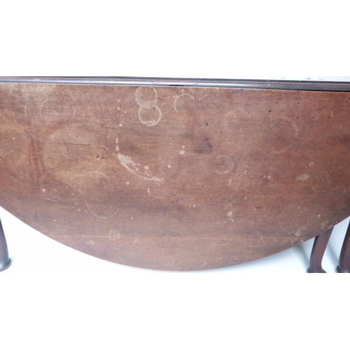 497 - George III mahogany drop flap wake or dining table on turned supports and pad feet, 189cm wide.