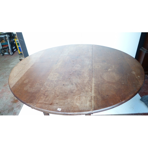 497 - George III mahogany drop flap wake or dining table on turned supports and pad feet, 189cm wide.
