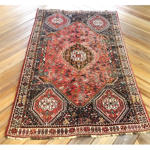 391 - Persian Qashqai hand knotted rug, featuring a central medallion within smaller Nomadic tribal design... 
