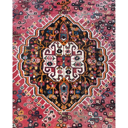 391 - Persian Qashqai hand knotted rug, featuring a central medallion within smaller Nomadic tribal design... 