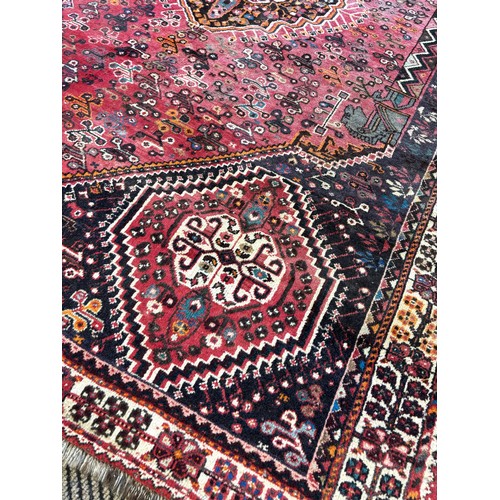 391 - Persian Qashqai hand knotted rug, featuring a central medallion within smaller Nomadic tribal design... 