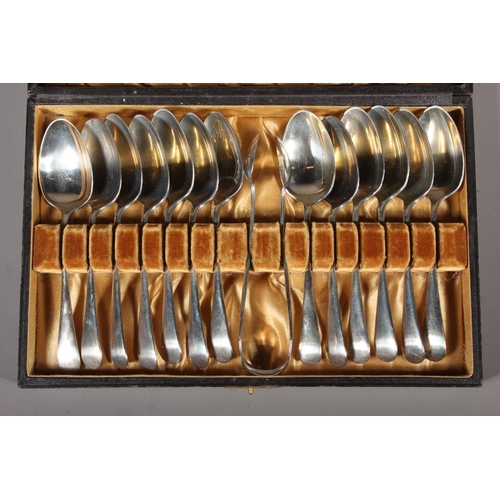 13 - Cased set of silver plated spoons and tongs.