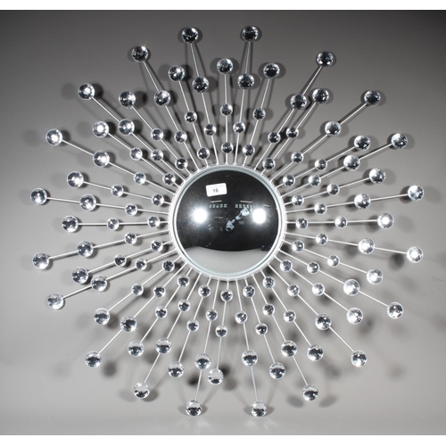 16 - Wall mirror with sunburst effect.