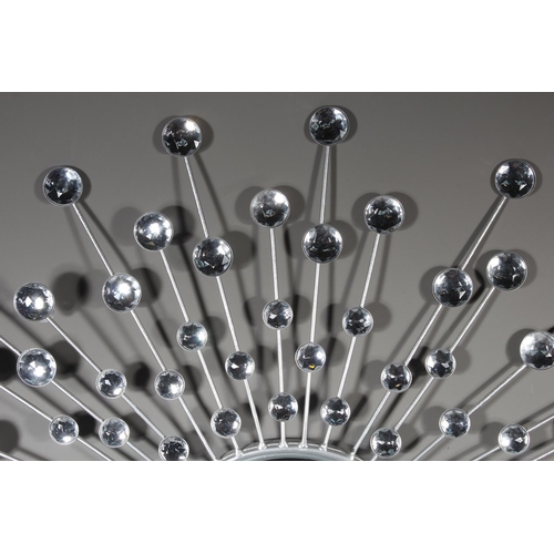 16 - Wall mirror with sunburst effect.