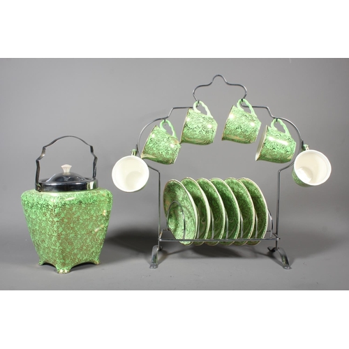22 - Brama Mid Winter green and gold pattern six piece and biscuit barrel set.
