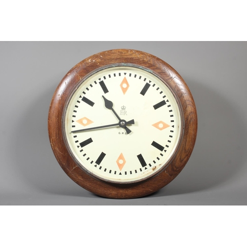 23 - Vintage G.P.O (General Post Office) wall clock with Elizabeth II stamp to the centre, 33cm dimeter.
