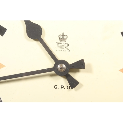 23 - Vintage G.P.O (General Post Office) wall clock with Elizabeth II stamp to the centre, 33cm dimeter.