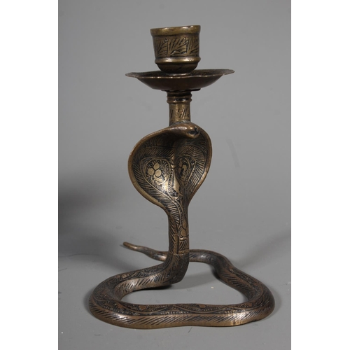 34 - Pair of brass cobra candlestick holders.