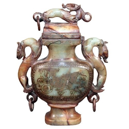 Oriental soapstone carving of a lidded incense burner decorated with dragon finial topped lid and flanked by two dragons to each side, 23cm tall
