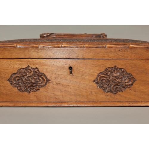 1 - Oriental carved mahogany box, the lid with carving of a dragon, 30cm long.&nbsp;