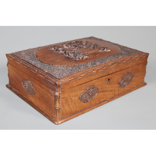1 - Oriental carved mahogany box, the lid with carving of a dragon, 30cm long.&nbsp;