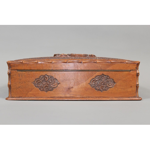 1 - Oriental carved mahogany box, the lid with carving of a dragon, 30cm long.&nbsp;