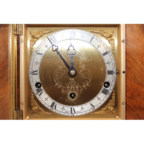 11 - Jamieson and Carry Elliot clock, chiming on seven gongs, held in walnut veneered case, 29cm long.&nb... 