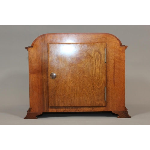 11 - Jamieson and Carry Elliot clock, chiming on seven gongs, held in walnut veneered case, 29cm long.&nb... 