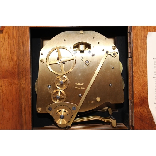 11 - Jamieson and Carry Elliot clock, chiming on seven gongs, held in walnut veneered case, 29cm long.&nb... 