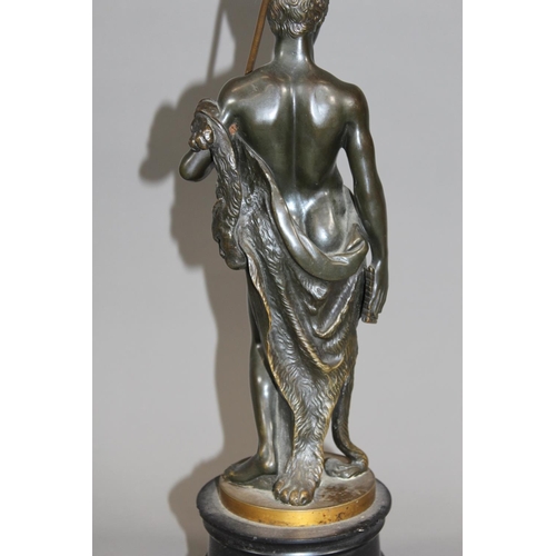 12 - French early 20th century bronzed metal table lamp in the form of a Roman figure holding pan pipes a... 