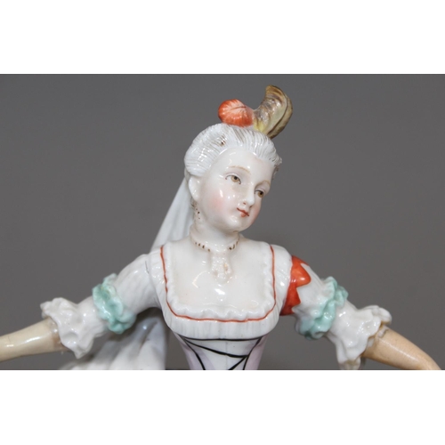 28 - Porcelain blue anchor mark figure modelled as a lady with yellow skirt, 19cm tall.&nbsp;