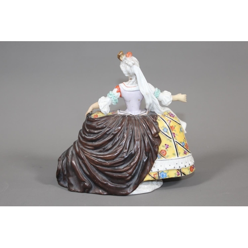 28 - Porcelain blue anchor mark figure modelled as a lady with yellow skirt, 19cm tall.&nbsp;