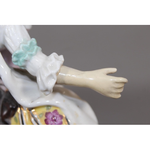 28 - Porcelain blue anchor mark figure modelled as a lady with yellow skirt, 19cm tall.&nbsp;