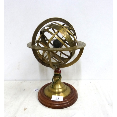 13 - Table top brass Armillary sphere engarved with celestial zodiac signs mounted on turned wood base. 2... 