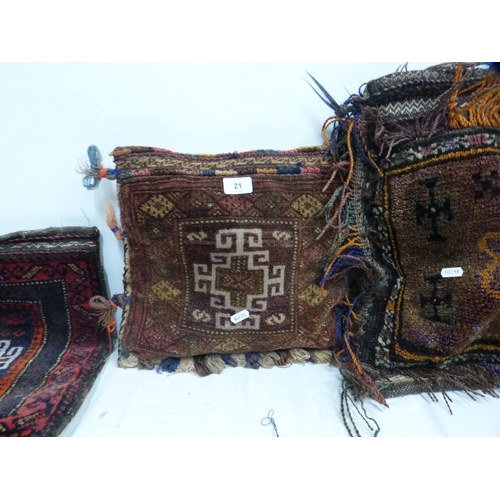 21 - Three 19th century Afghan Baluchi nomad carpet cushions.
