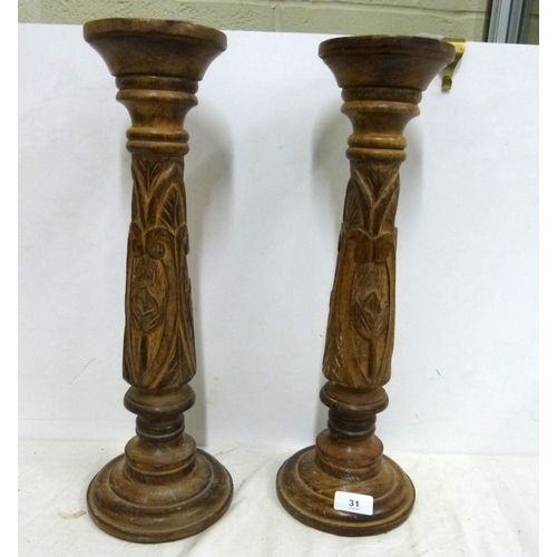 31 - Pair of modern carved candlesticks