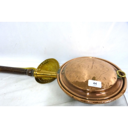 44 - Copper bed warmer also a brass sieve spoon.