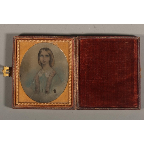 10 - Leather cased portrait miniature of a young lady, white collar, faded blue top.