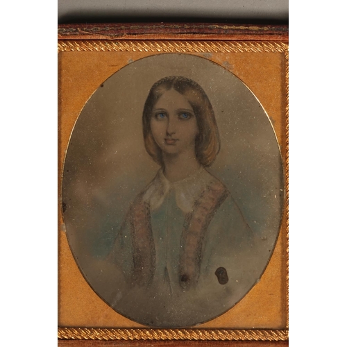 10 - Leather cased portrait miniature of a young lady, white collar, faded blue top.