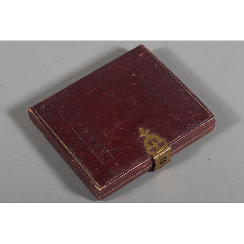 10 - Leather cased portrait miniature of a young lady, white collar, faded blue top.