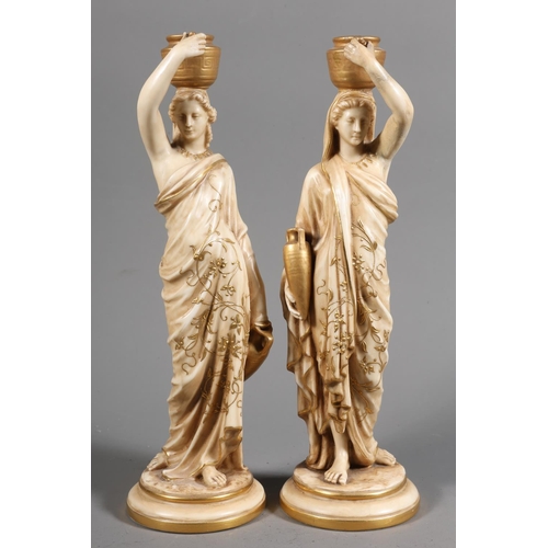 15 - Pair of Royal Worcester figurines modelled as Grecian water carriers, 25cm high.