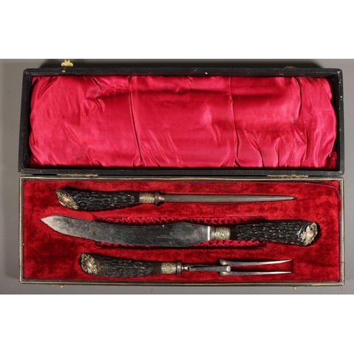 16 - Cased carving set comprising of faux horn-handled knife, fork and sharpener, Francis Howard, Aberdee... 