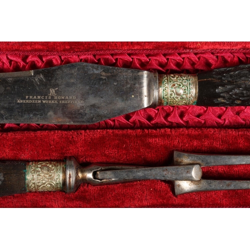 16 - Cased carving set comprising of faux horn-handled knife, fork and sharpener, Francis Howard, Aberdee... 