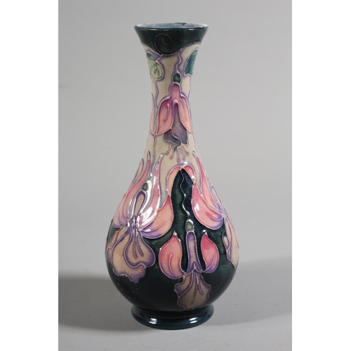 2 - Moorcroft baluster vase, floral decoration over green ground, marked 'Moorcroft England MCC174', 7cm... 