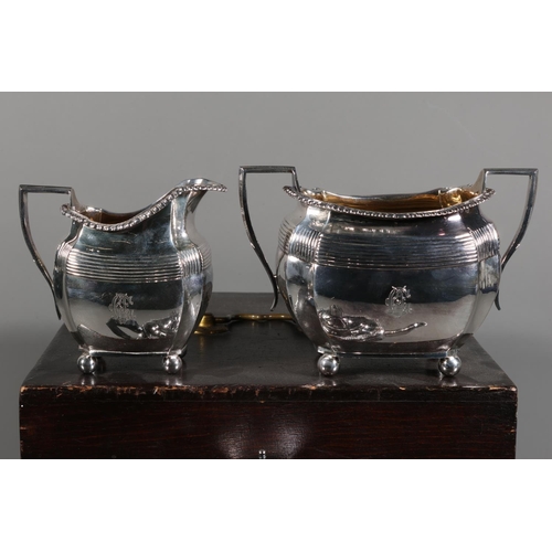 23 - Cased Elkington three piece teaset comprising teapot, bowl and jug.