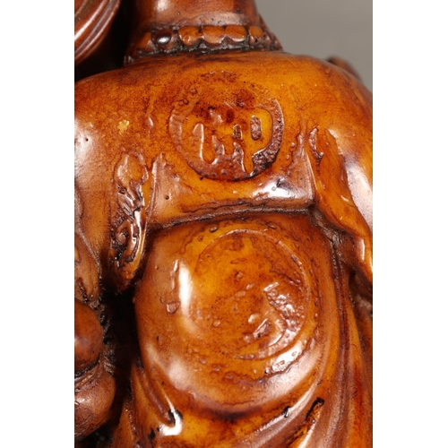 32 - Pair of resin Buddha models.