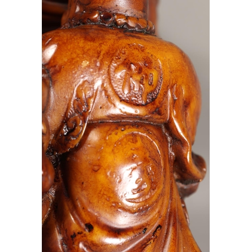 32 - Pair of resin Buddha models.