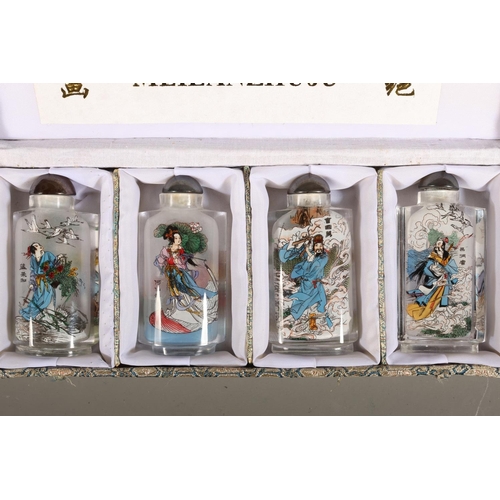 45 - Meilanzhugu set of four perfume bottles decorated with characters.