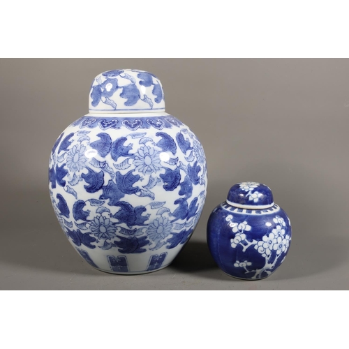 53 - Blue and white ginger jar, foliate decoration and a smaller with prunus decoration.&nbsp; (2)