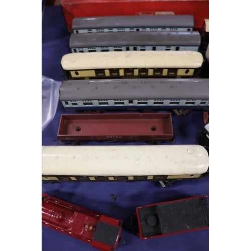 55 - Triang Hornby model railway track, carriages, and a locomotive.
