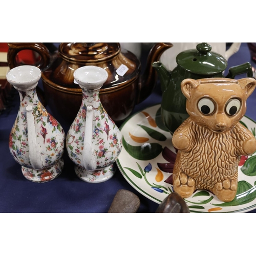 57 - Ceramics including teapots, a money box, plates and a condiment set.