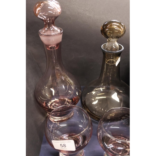 58 - Smoked glass decanters and glasses.