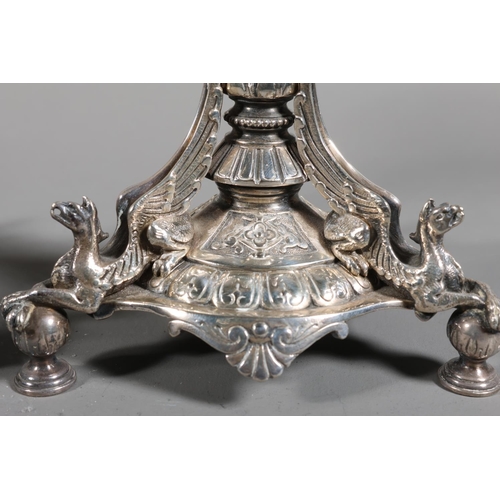 6 - Pair of plated table stands with scalloped circular top on elaborate baluster column, mounted by tri... 