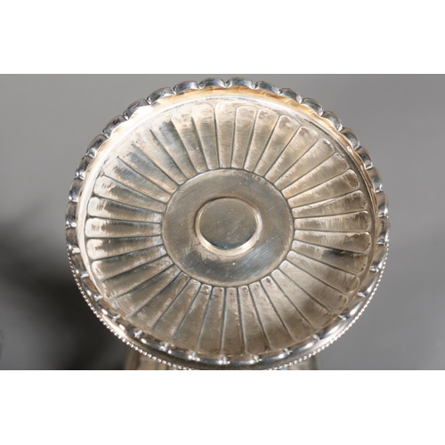 6 - Pair of plated table stands with scalloped circular top on elaborate baluster column, mounted by tri... 