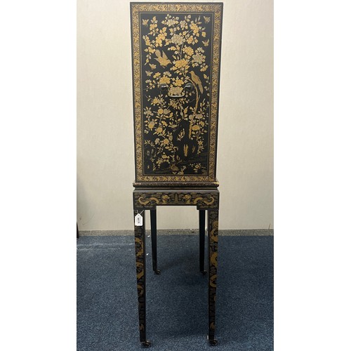 518 - Japanese lacquered cabinet on stand, rectangular top over door enclosing cupboard and drawers, raise... 