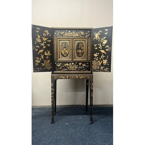 518 - Japanese lacquered cabinet on stand, rectangular top over door enclosing cupboard and drawers, raise... 