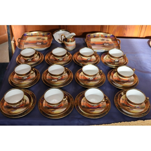 463 - Noritake of Japan, a thirty-eight piece bone china tea set decorated with Indian scenes depicting an... 
