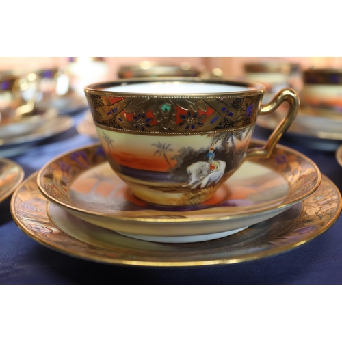 463 - Noritake of Japan, a thirty-eight piece bone china tea set decorated with Indian scenes depicting an... 